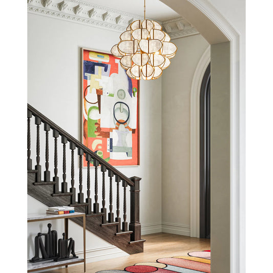 Galatea Chandelier by Currey and Company in natural, brass. Made from capiz shell, wrought iron in a eclectic & global style.