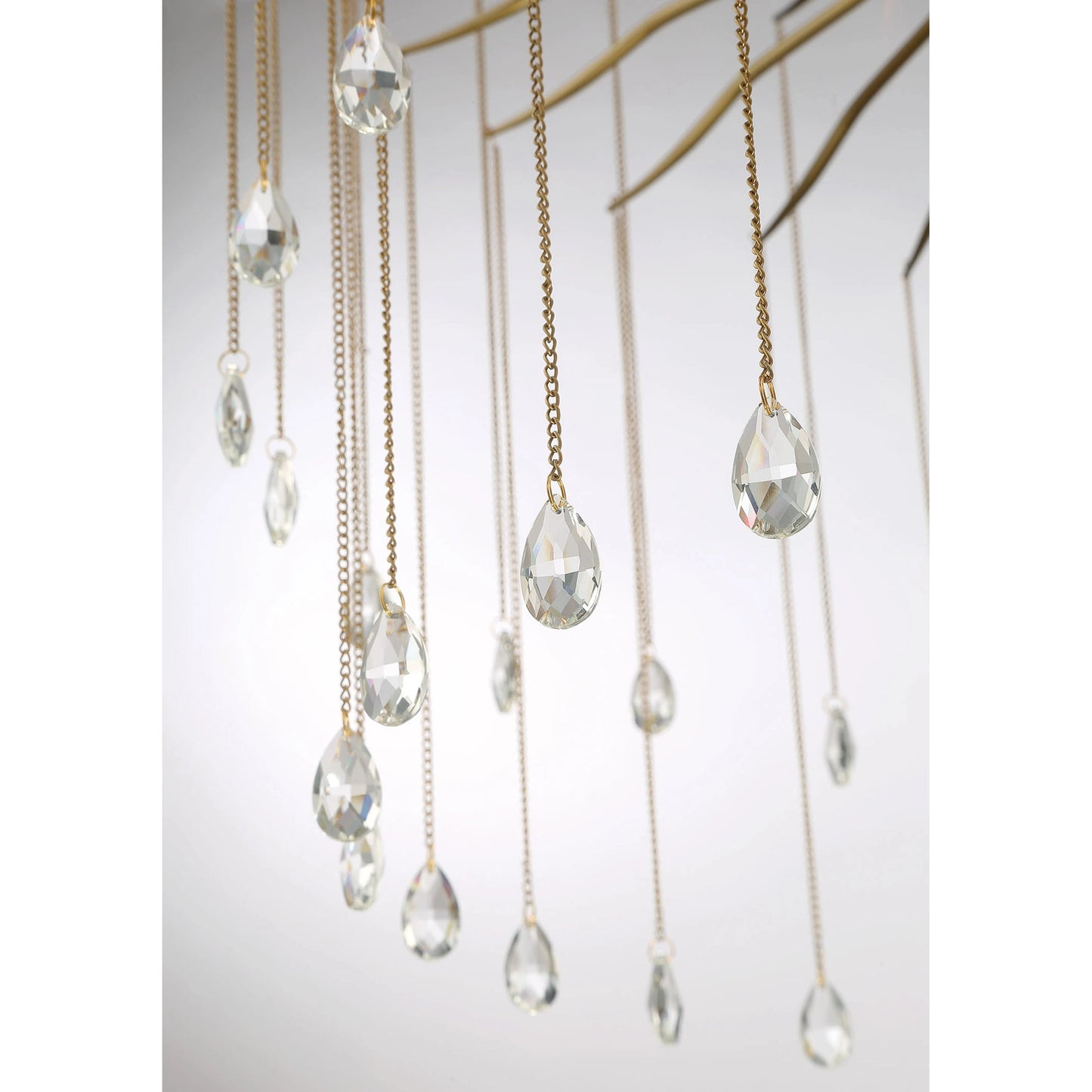 004 SI-1965985 | Closeup | Lark 6-Light Chandelier by Lumanity in brass. Made from iron, crystal in a modern style.