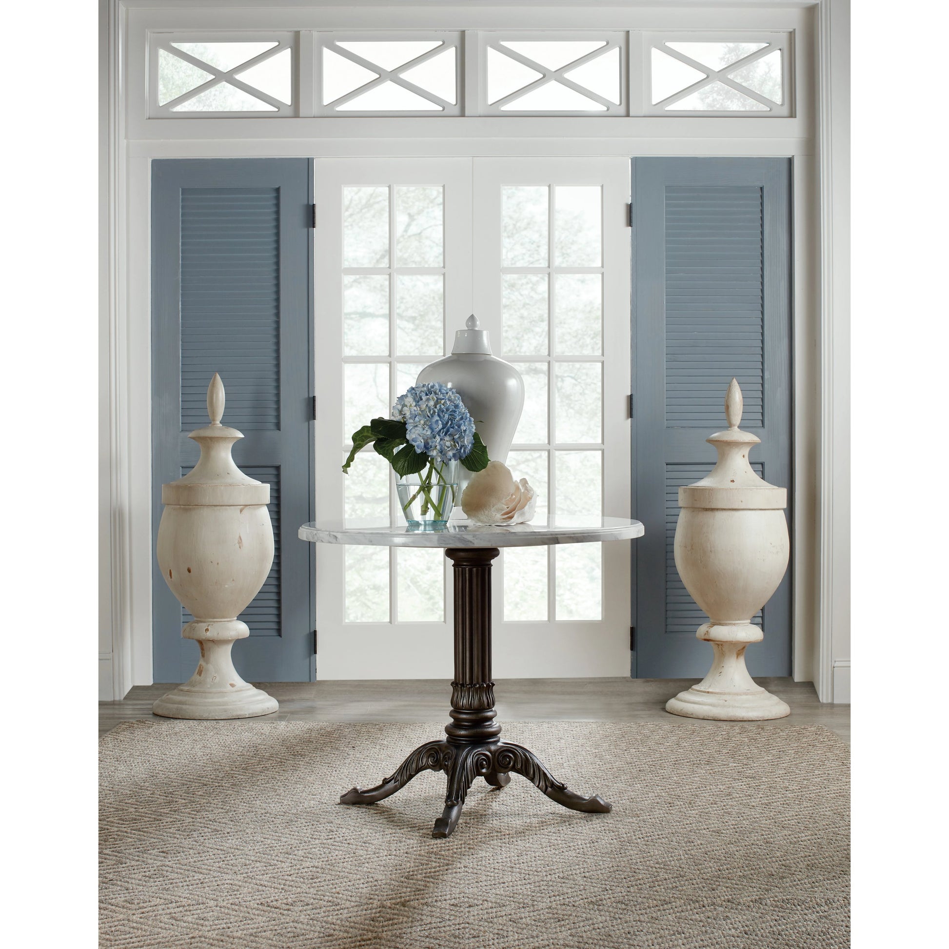 Charleston Bistro Table by Hooker Furniture in garden gate black. Made from resin with veneered carrara stone in a modern style.