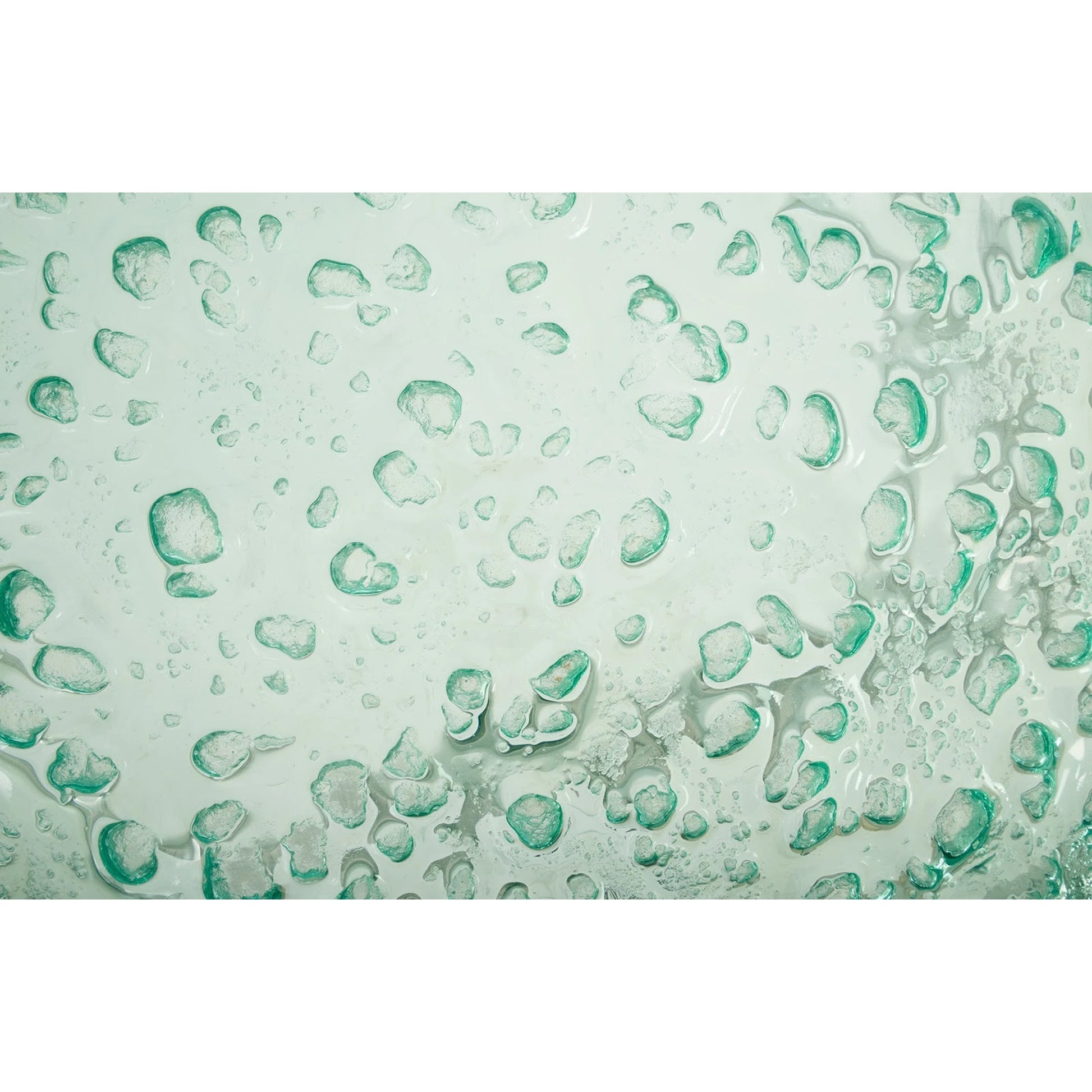 Bubble Glass Coffee Table by Phillips Collection in turquoise. Made from glass metal, stainless steel in a coastal style.