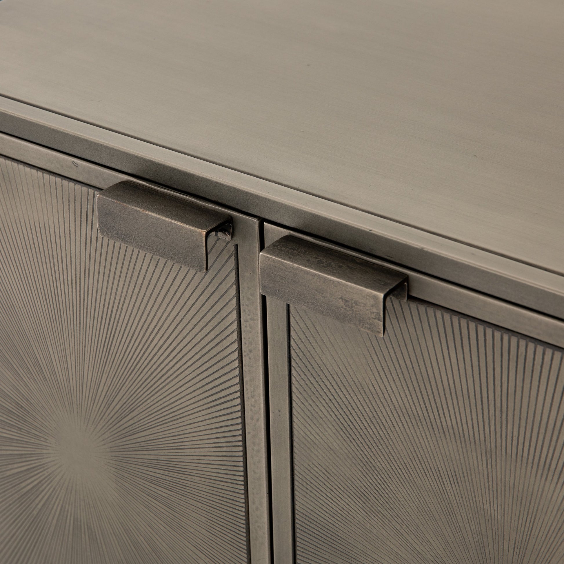 Sunburst Cabinet Nightstand by Four Hands in sunburst etched aged brass, gunmetal, aged brass and sunburst etched aged brass pc, gunmetal, aged brass pc. Made from iron in a modern style.
