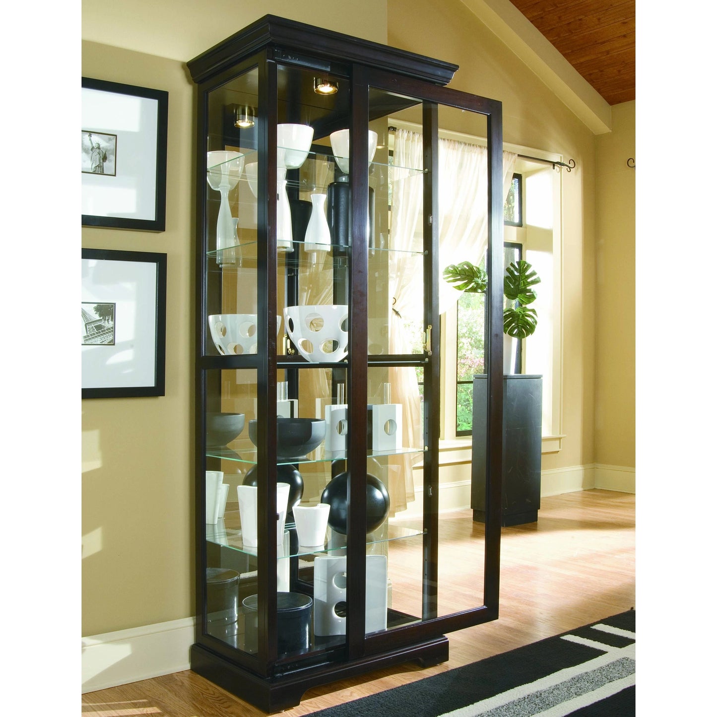 004 SI-2155434 | Lifestyle | 30'' Wide Hardwood Chocolate Cherry Curio Display Cabinet by Pulaski Furniture in chocolate cherry. Made from select hardwood solids, veneers in a traditional style.