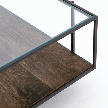 Byron Coffee Table by Four Hands in gunmetal, aged brown, tempered glass and dark iron, aged brown, tempered glass. Made from iron, solid mango, tempered glass in a modern style.