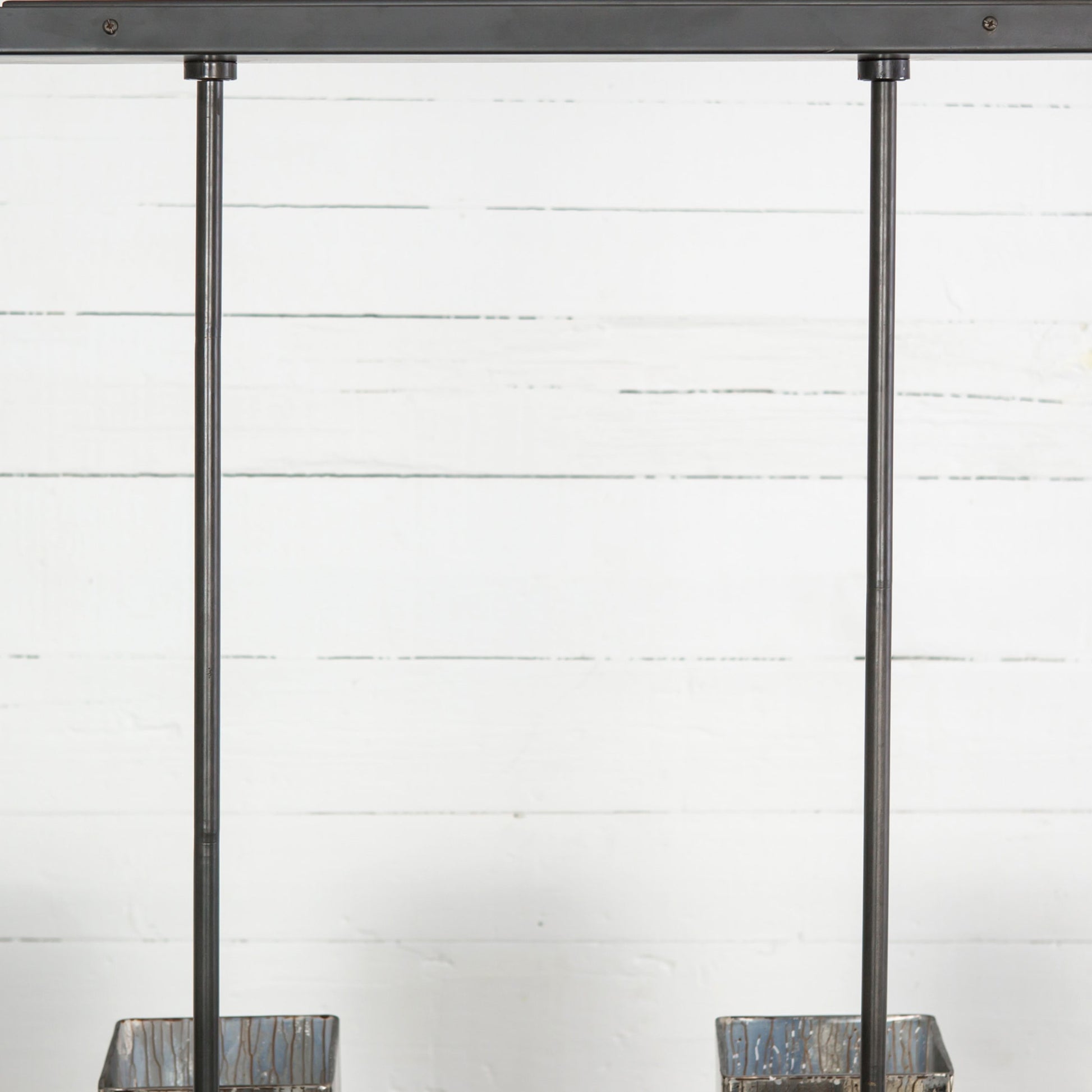 Ava Linear Chandelier by Four Hands in antiqued iron, aged metallic glass. Made from iron, glass in a modern style.