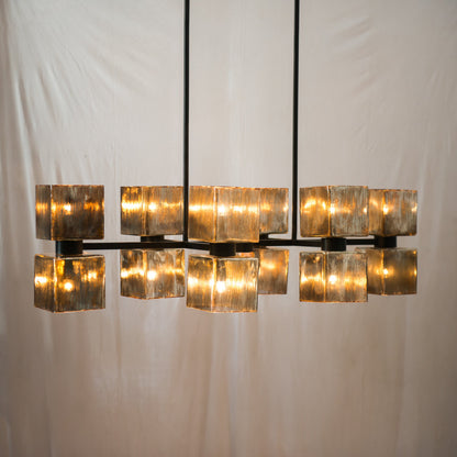 Ava Linear Chandelier by Four Hands in antiqued iron, aged metallic glass. Made from iron, glass in a modern style.