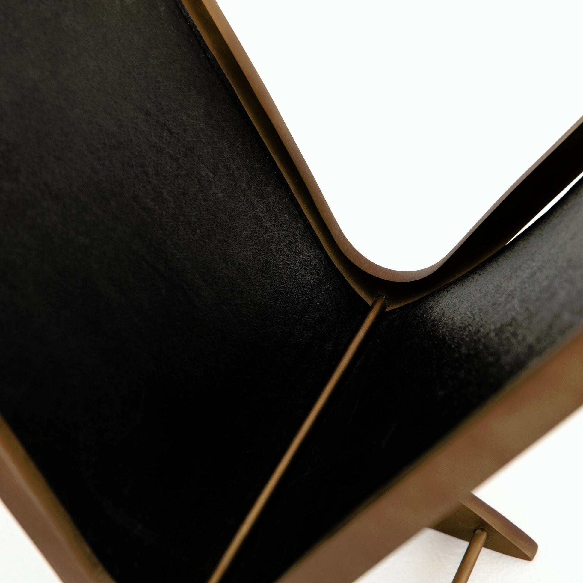 Feldman Magazine Rack by Four Hands in rustic brass, perforated black. Made from aluminum, faux leather in a cottage & farmhouse style.