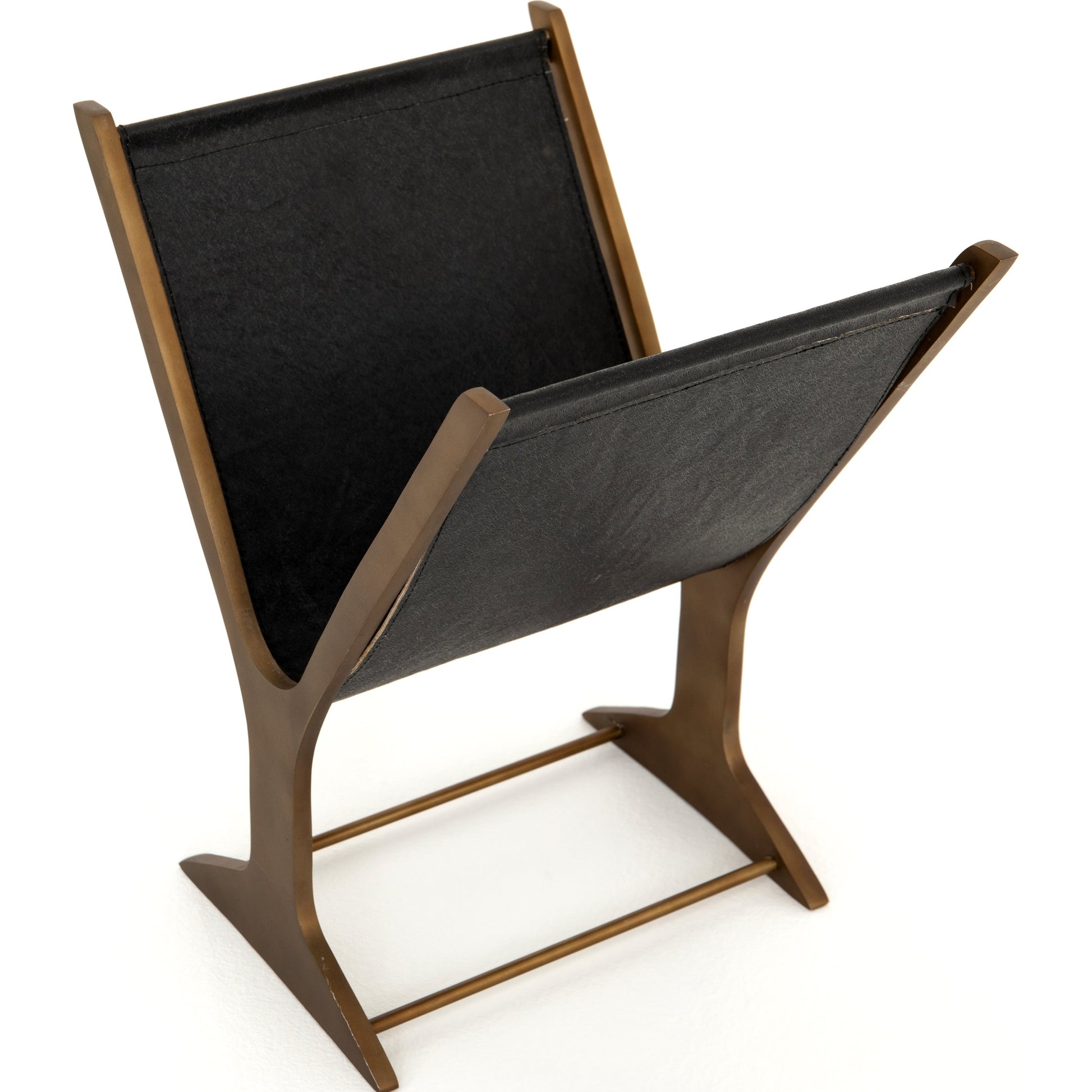 Feldman Magazine Rack by Four Hands in rustic brass, perforated black. Made from aluminum, faux leather in a cottage & farmhouse style.