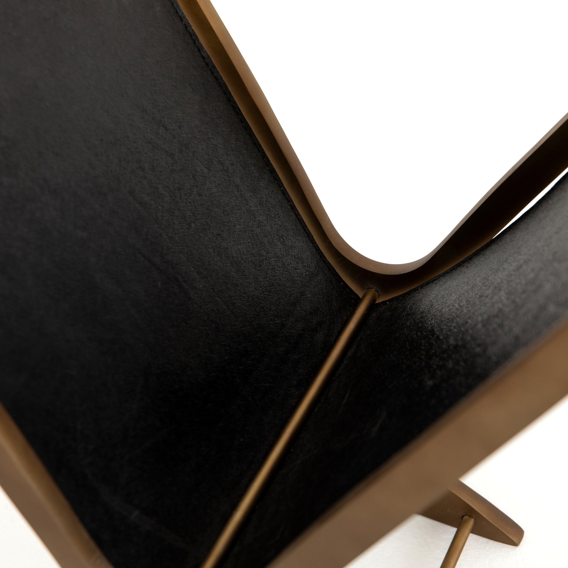 Feldman Magazine Rack by Four Hands in rustic brass, perforated black. Made from aluminum, faux leather in a cottage & farmhouse style.