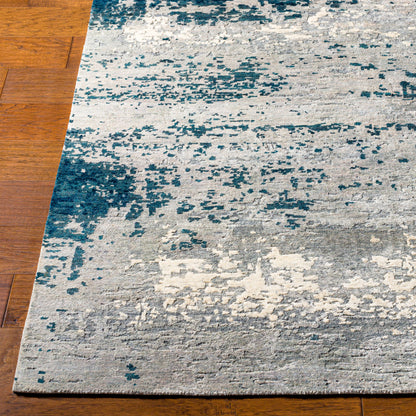 Imola Rug - 26077 by Surya in light beige, gray, light gray, dark blue, teal, charcoal. Made from 90% viscose, 10% nz wool in a unique style.