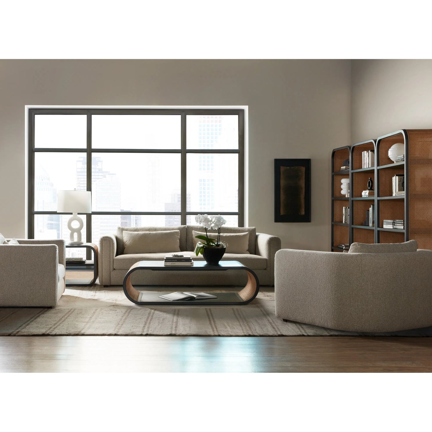 004 SI-2193361 | Lifestyle | Cain Rectangle Coffee Table by Hooker Furniture in black finish with brown cane accents. Made from unique in a rustic style.