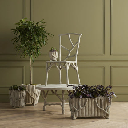 Faux Bois Planter by Currey and Company in portland, faux bois. Made from concrete, iron in a rustic style.
