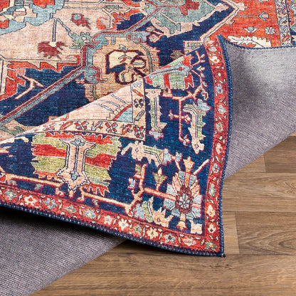 Iris Rug by Livabliss in red, burnt orange, dark blue, ink blue, pale blue, green. Made from 100% polyester in a traditional style.