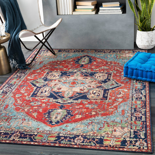 Iris Rug by Livabliss in red, burnt orange, dark blue, ink blue, pale blue, green. Made from 100% polyester in a traditional style.