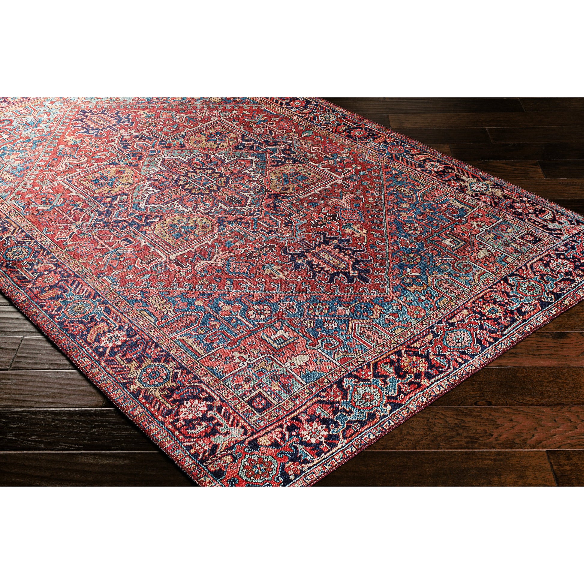 Iris Rug by Livabliss in dark blue, red, tan, teal, cream. Made from 100% polyester in a traditional style.