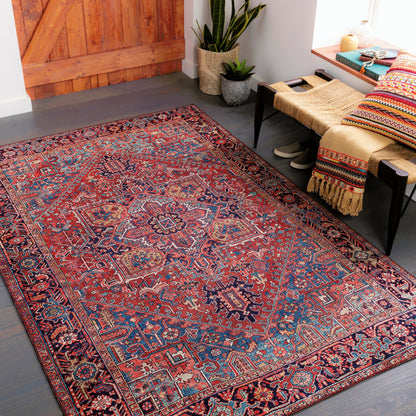 Iris Rug by Livabliss in dark blue, red, tan, teal, cream. Made from 100% polyester in a traditional style.
