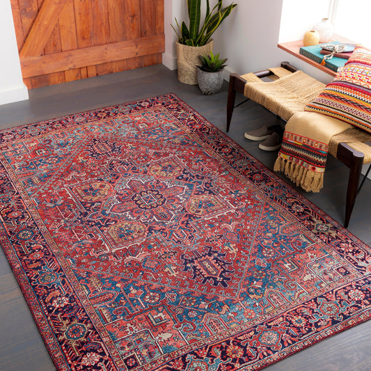 Iris Rug by Livabliss in red, bright blue, navy. Made from 100% polyester in a traditional style.