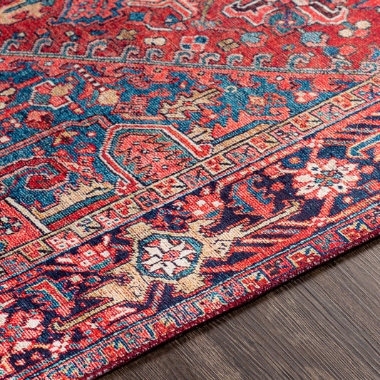 Iris Rug by Livabliss in red, bright blue, navy. Made from 100% polyester in a traditional style.