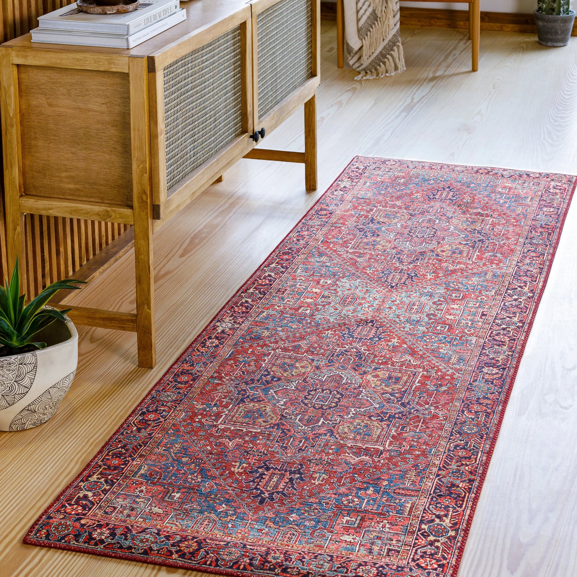 Iris Rug by Livabliss in dark blue, red, tan, teal, cream. Made from 100% polyester in a traditional style.