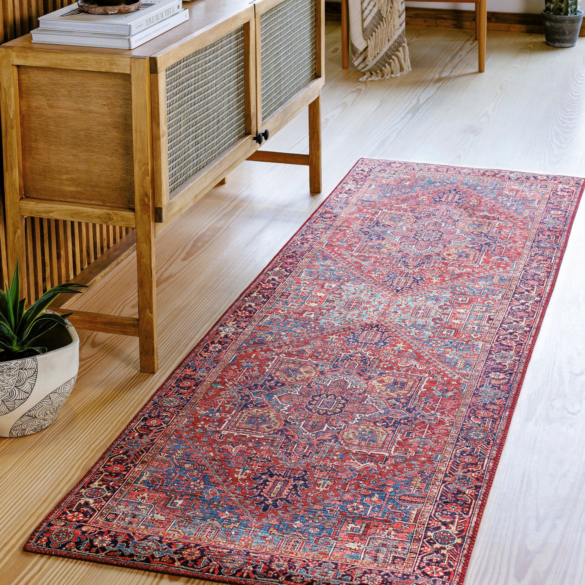 Iris Rug by Livabliss in dark blue, red, tan, teal, cream. Made from 100% polyester in a traditional style.