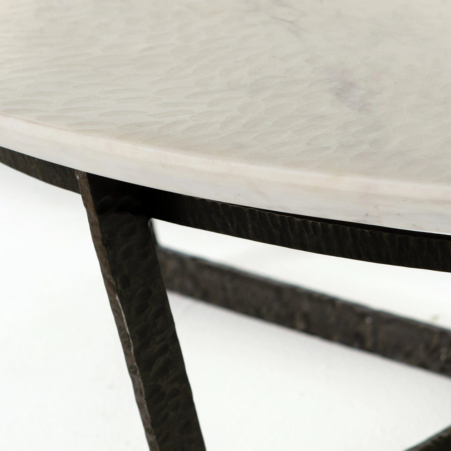 038 S-279309 | Closeup | Felix Round Coffee Table by Four Hands in sandblasted white marble. Made from solid marble, iron, engineered hardwood in a modern style.