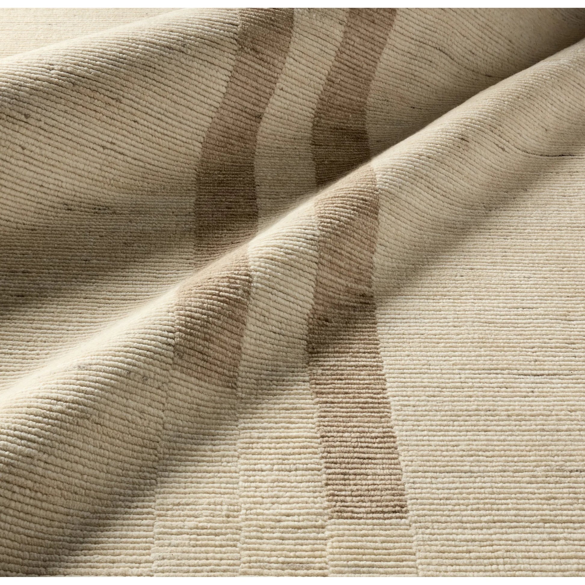 In The Distance ITD02 Rug by Jaipur Living in ivory, white, tan, taupe. Made from 100% wool in a unique style.