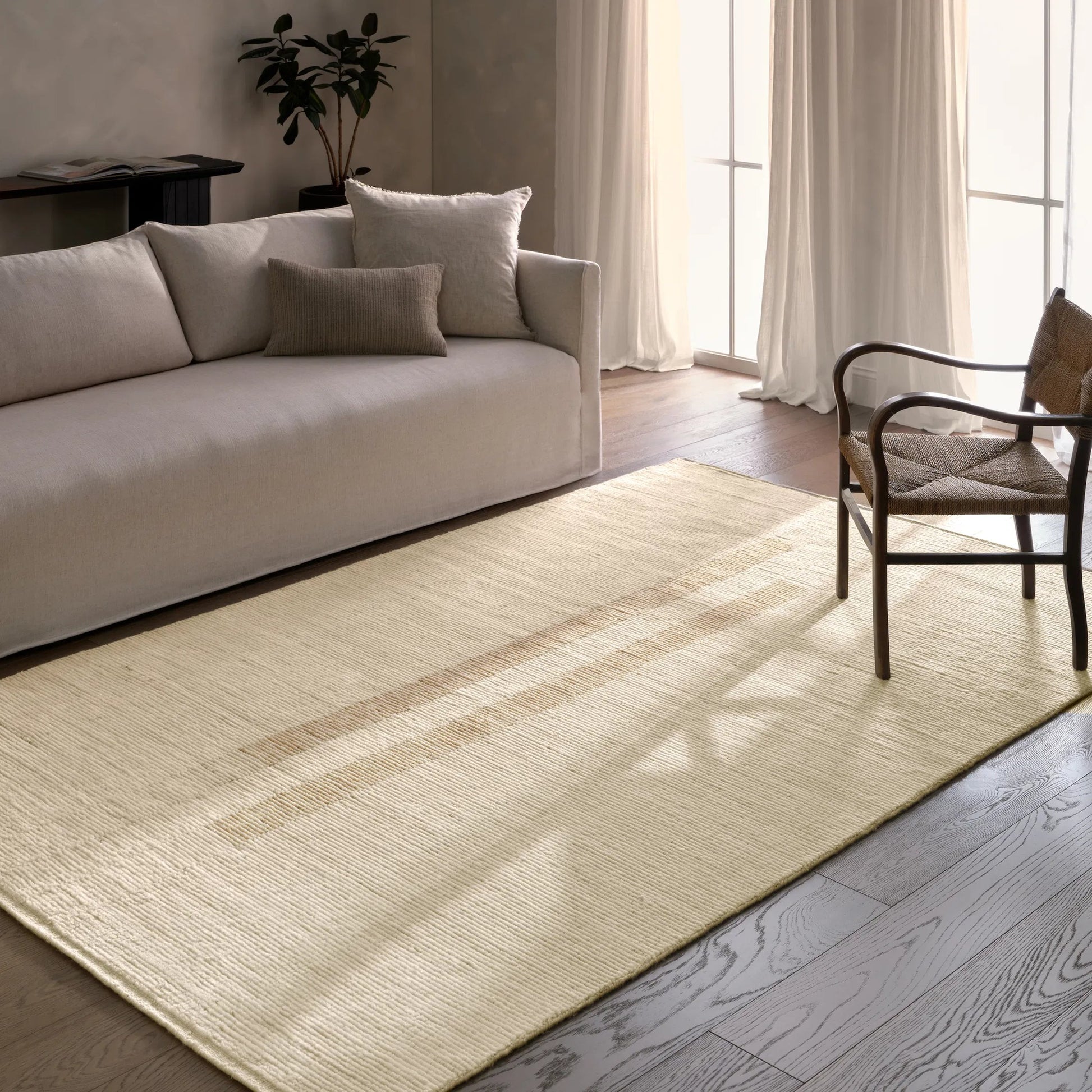 In The Distance ITD02 Rug by Jaipur Living in ivory, white, tan, taupe. Made from 100% wool in a unique style.