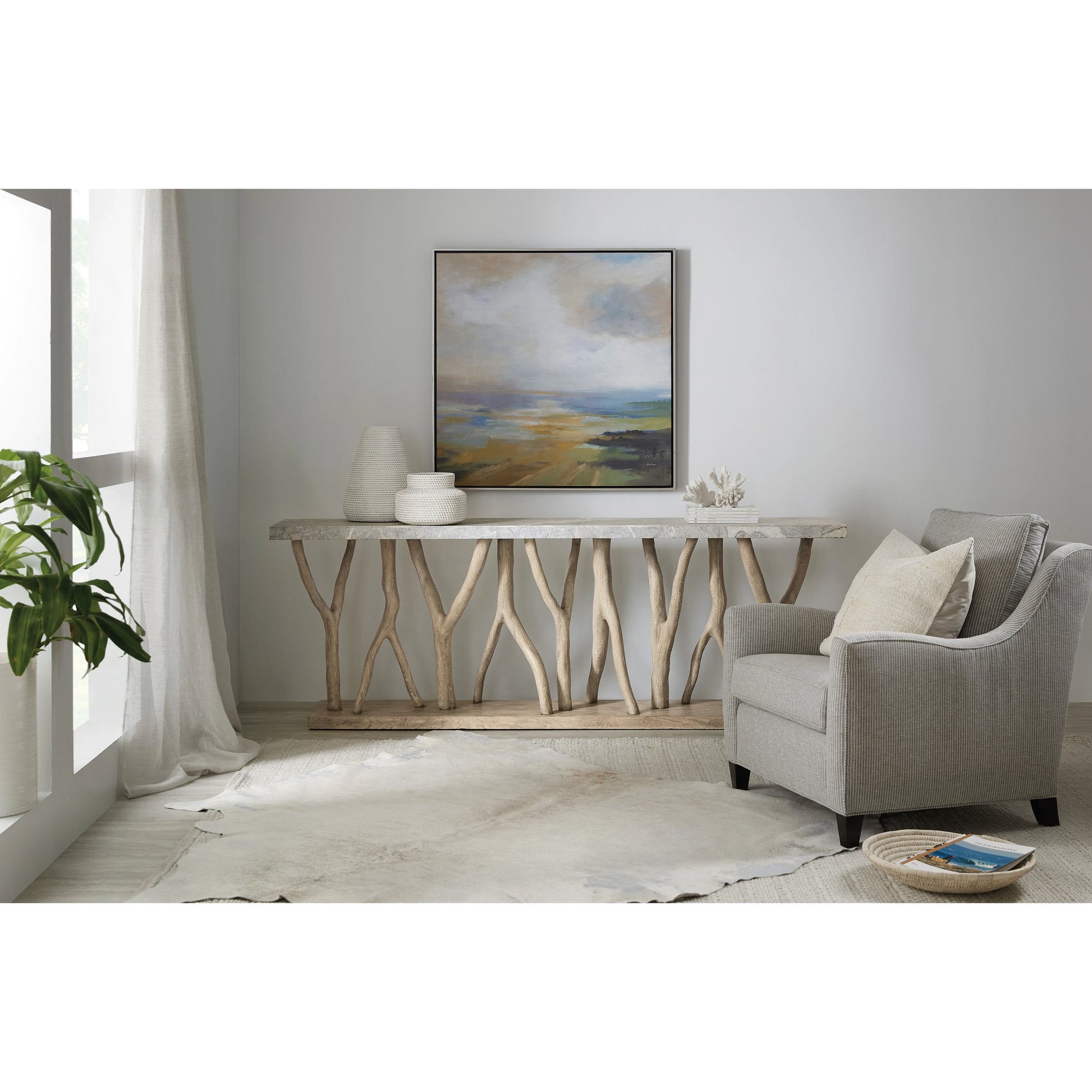 Surfrider Console Table by Hooker Furniture in light natural wood. Made from pecan veneers with stone veneer, resin in a modern style.