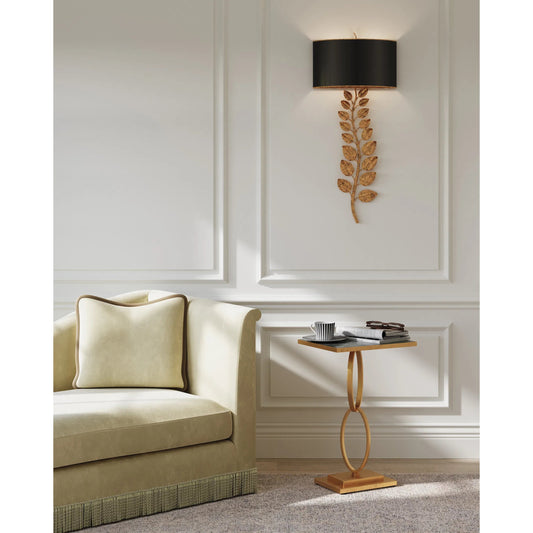 Bangle Accent Table by Currey and Company in gold leaf. Made from iron, glass in a modern style.