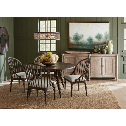 Revival Row Round Table by Pulaski Furniture in chimney smoke. Made from rubberwood in a traditional style.