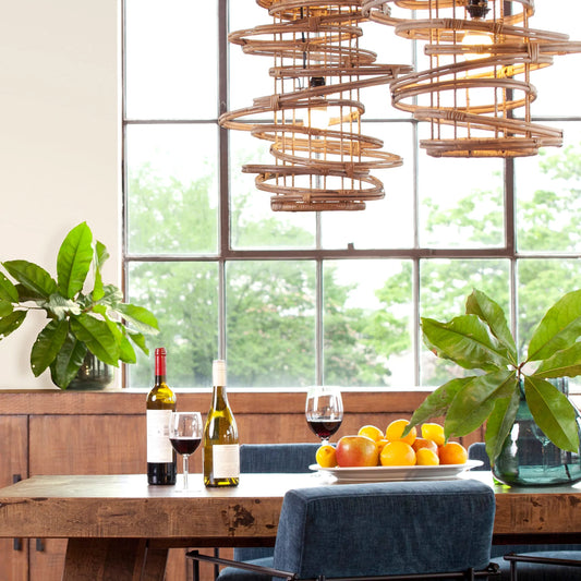 Swirling Bohemian Rattan Pendant Light by Arch & Plane in brown, natural and natural rattan finish. Made from iron, rattan in a modern style.
