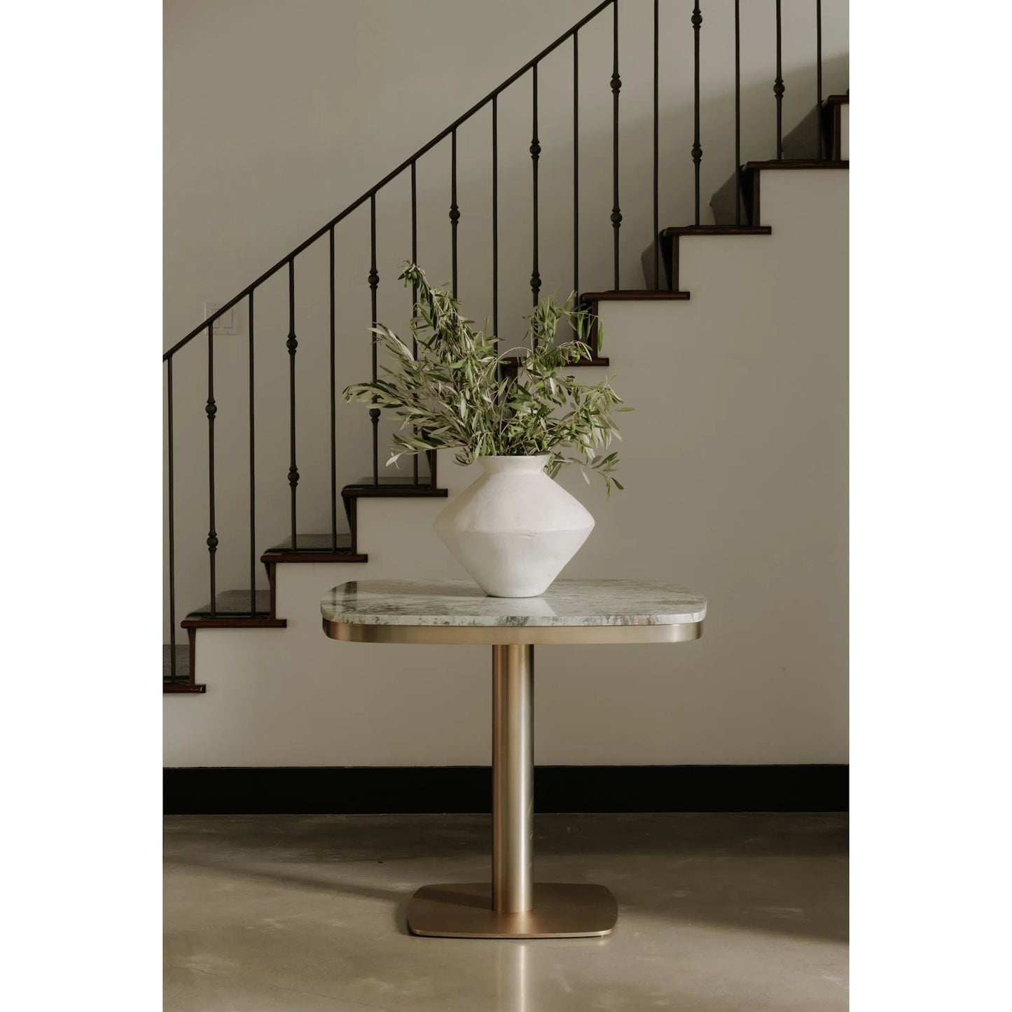 015 SI-2253635 | Lifestyle | Celeste Cafe Table by Moe's Home Collection in natural, antique brass. Made from marble top, antiqued, brass iron base, mdf underneath marble for top support in a modern style.
