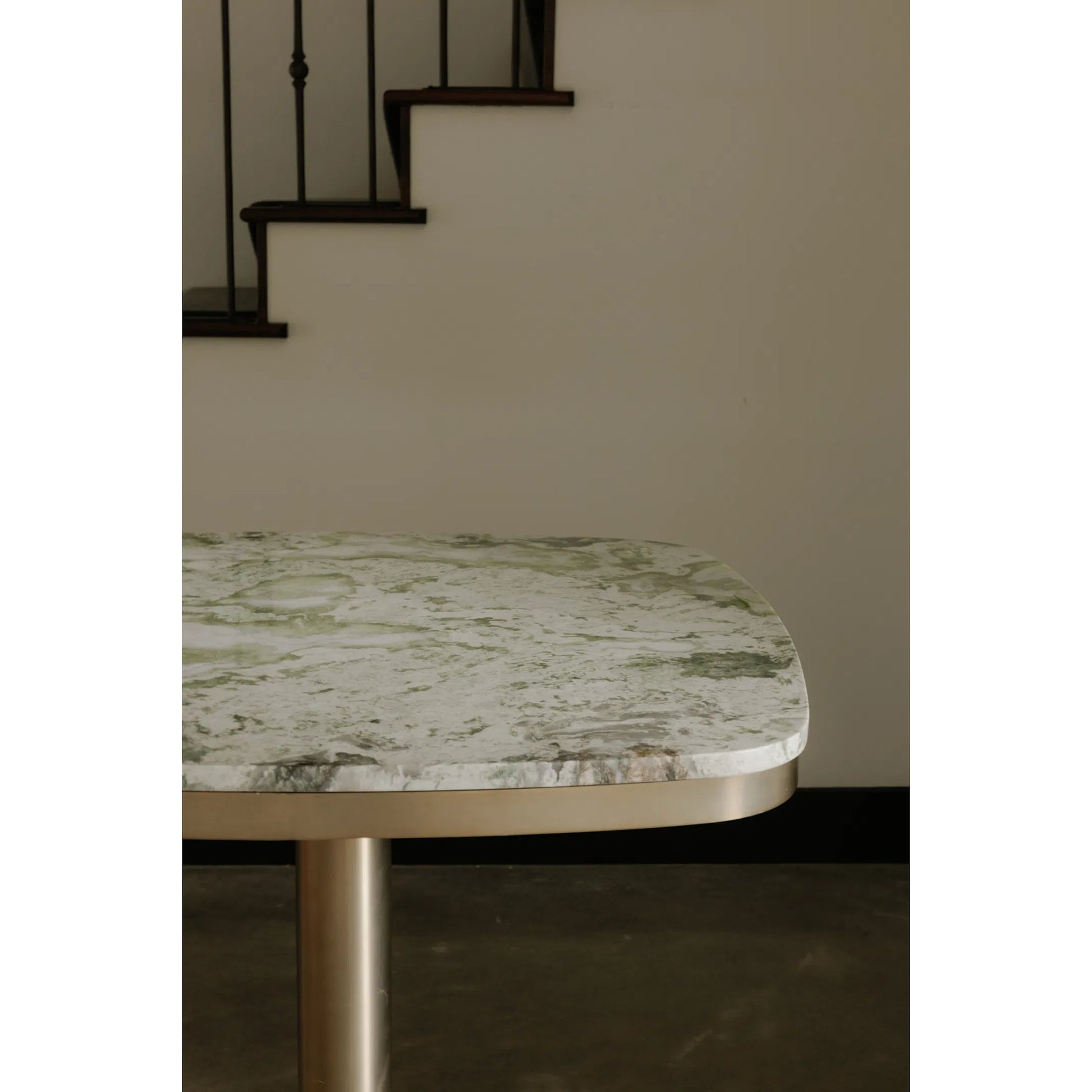 Celeste Cafe Table by Moe's Home Collection in natural, antique brass. Made from marble top, antiqued, brass iron base, mdf underneath marble for top support in a modern style.