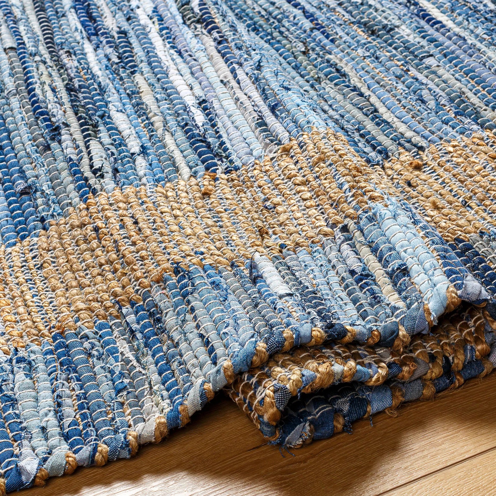 Jean Rug - 32470 by Livabliss. Made from main: 60% recycled fabric, main: 40% jute in a unique style.