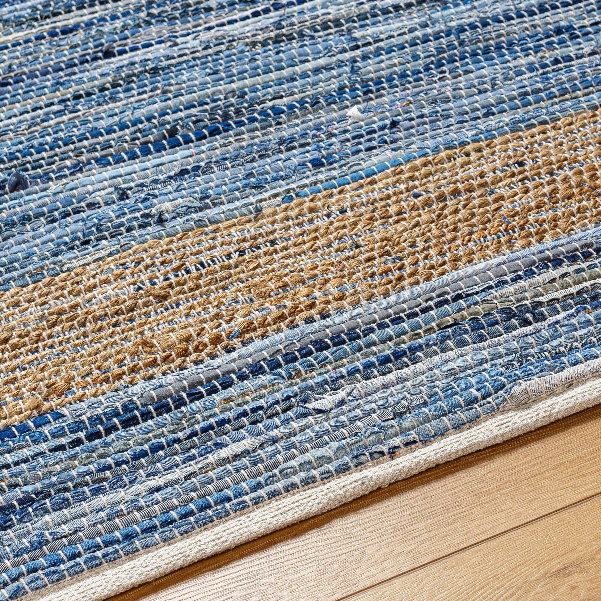 Jean Rug - 32470 by Livabliss. Made from main: 60% recycled fabric, main: 40% jute in a unique style.