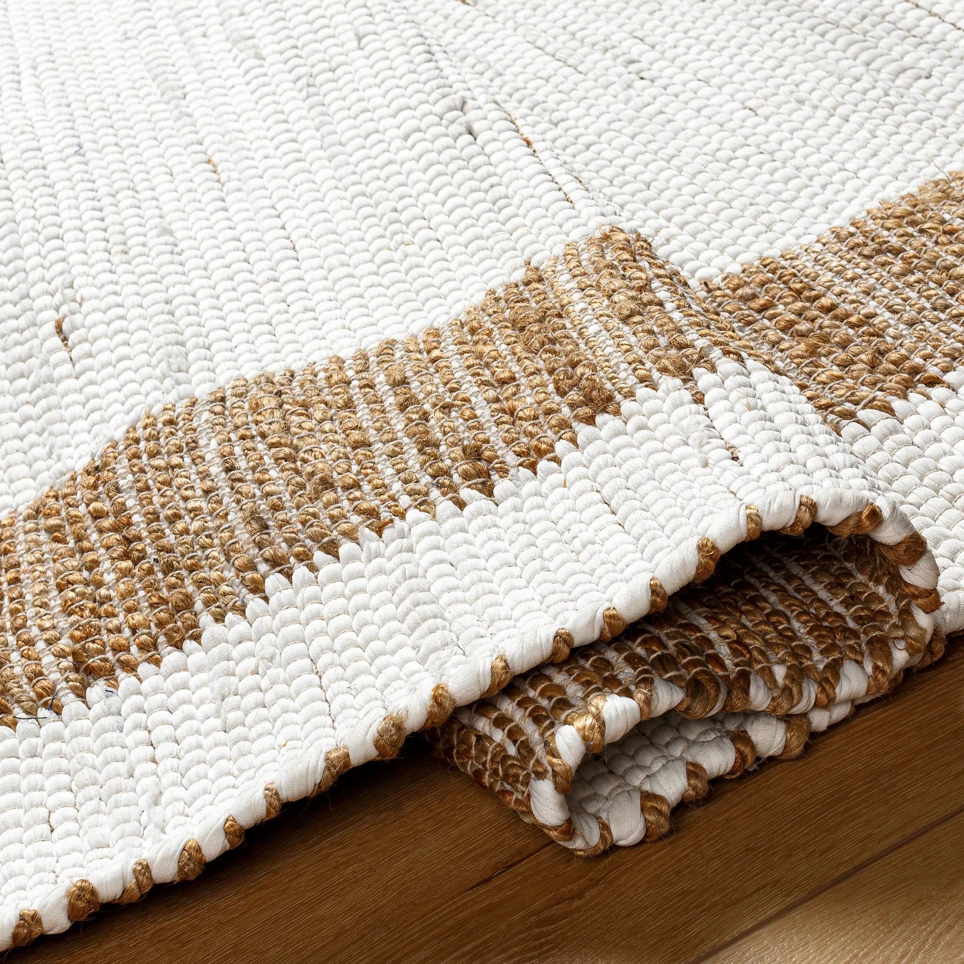 Jean Rug - 32470 by Livabliss. Made from main: 60% recycled fabric, main: 40% jute in a unique style.