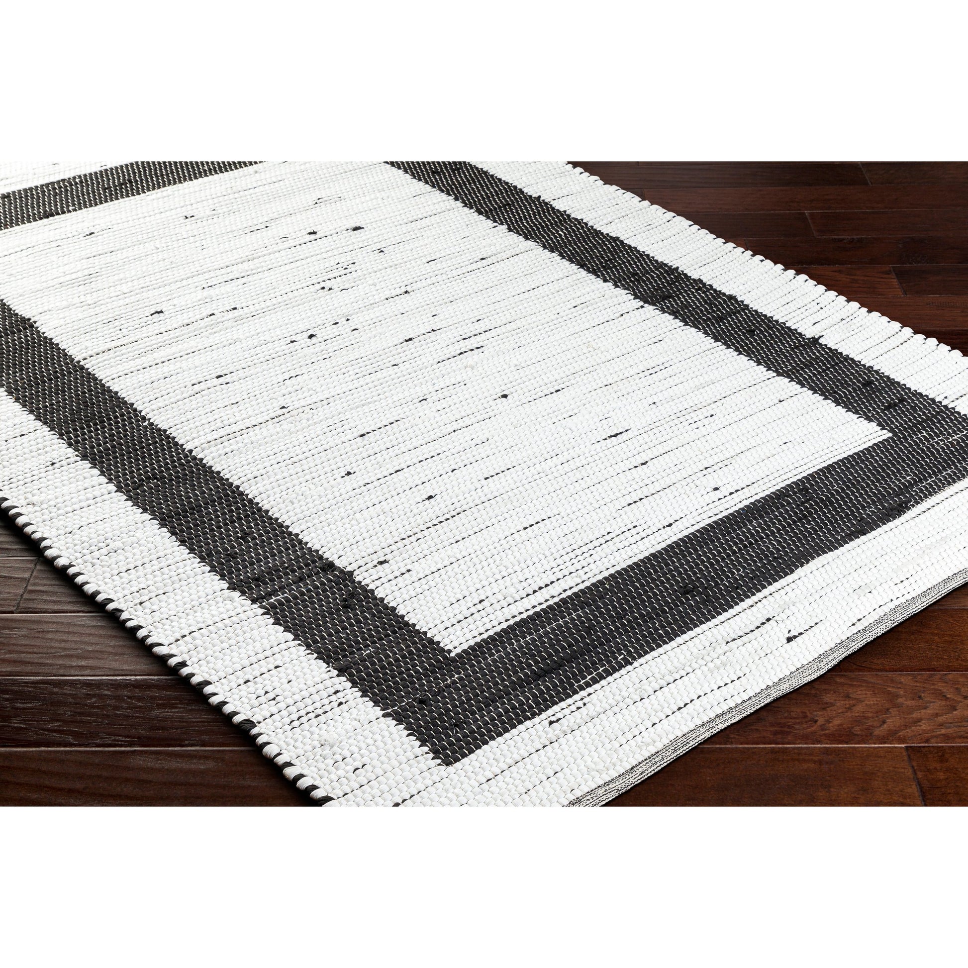 Jean Rug - 32471 by Livabliss in ivory, black. Made from main: 100% recycled fabric in a unique style.