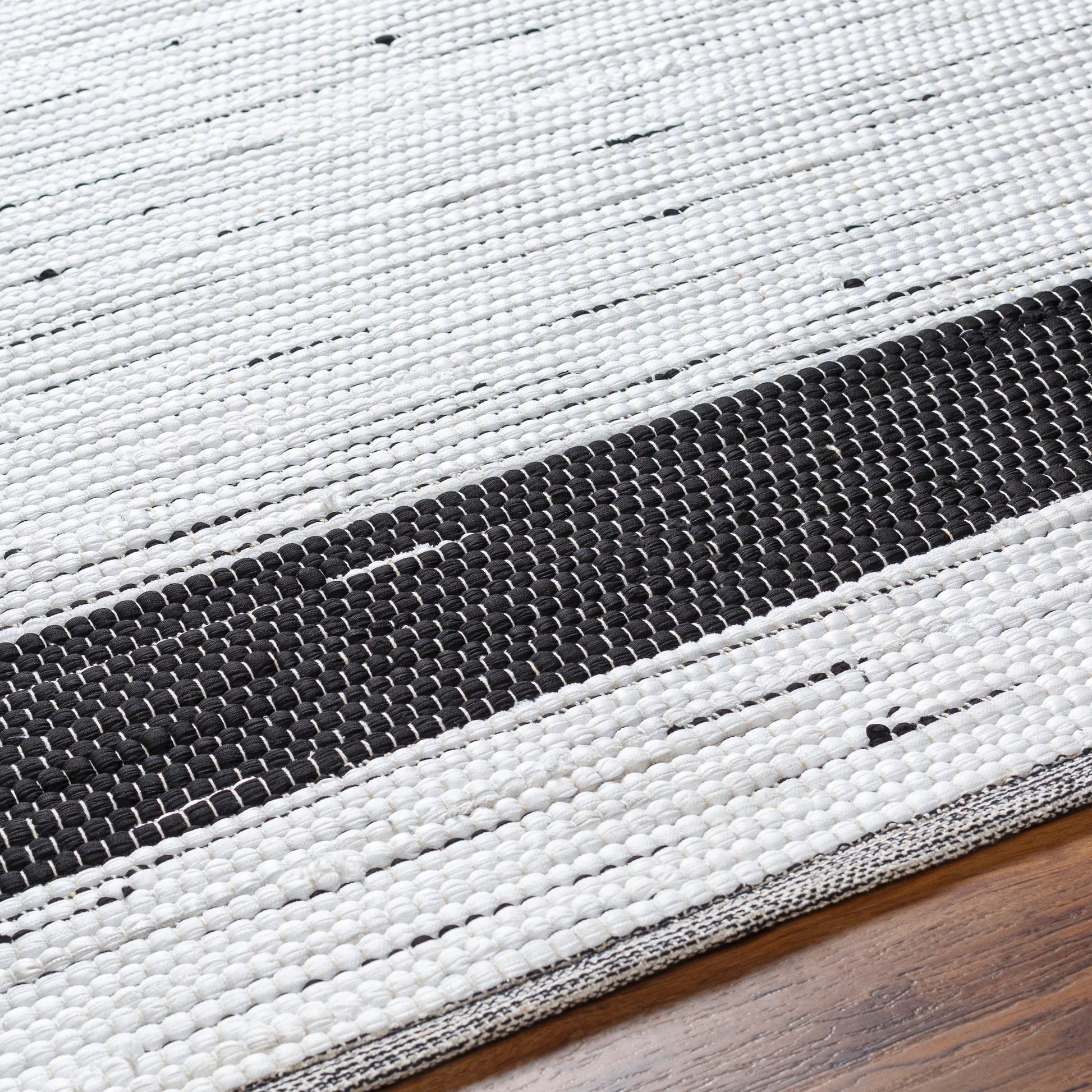 Jean Rug - 32471 by Livabliss in ivory, black. Made from main: 100% recycled fabric in a unique style.