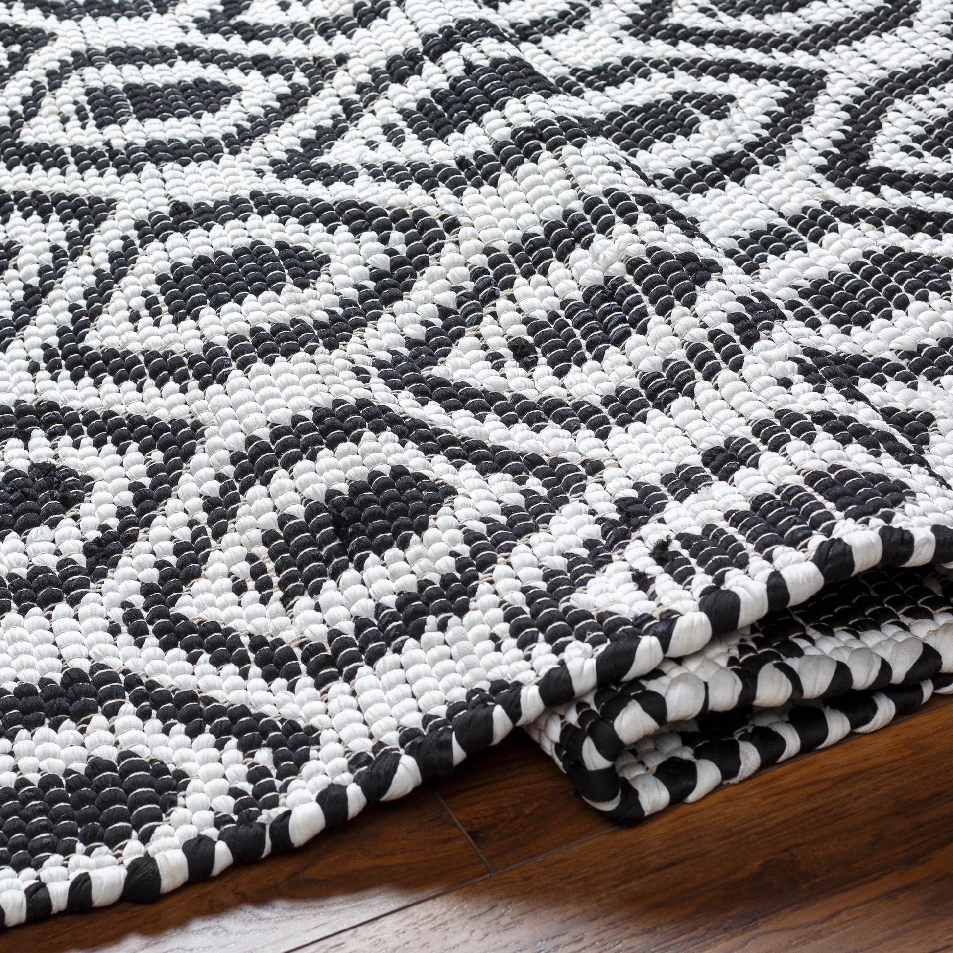 Jean Rug - 32473 by Livabliss in ivory, black. Made from main: 100% recycled fabric in a unique style.