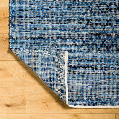 Jean Rug - 32476 by Livabliss in denim blue, slate gray, charcoal, sky blue, steel blue. Made from main: 100% recycled fabric in a unique style.
