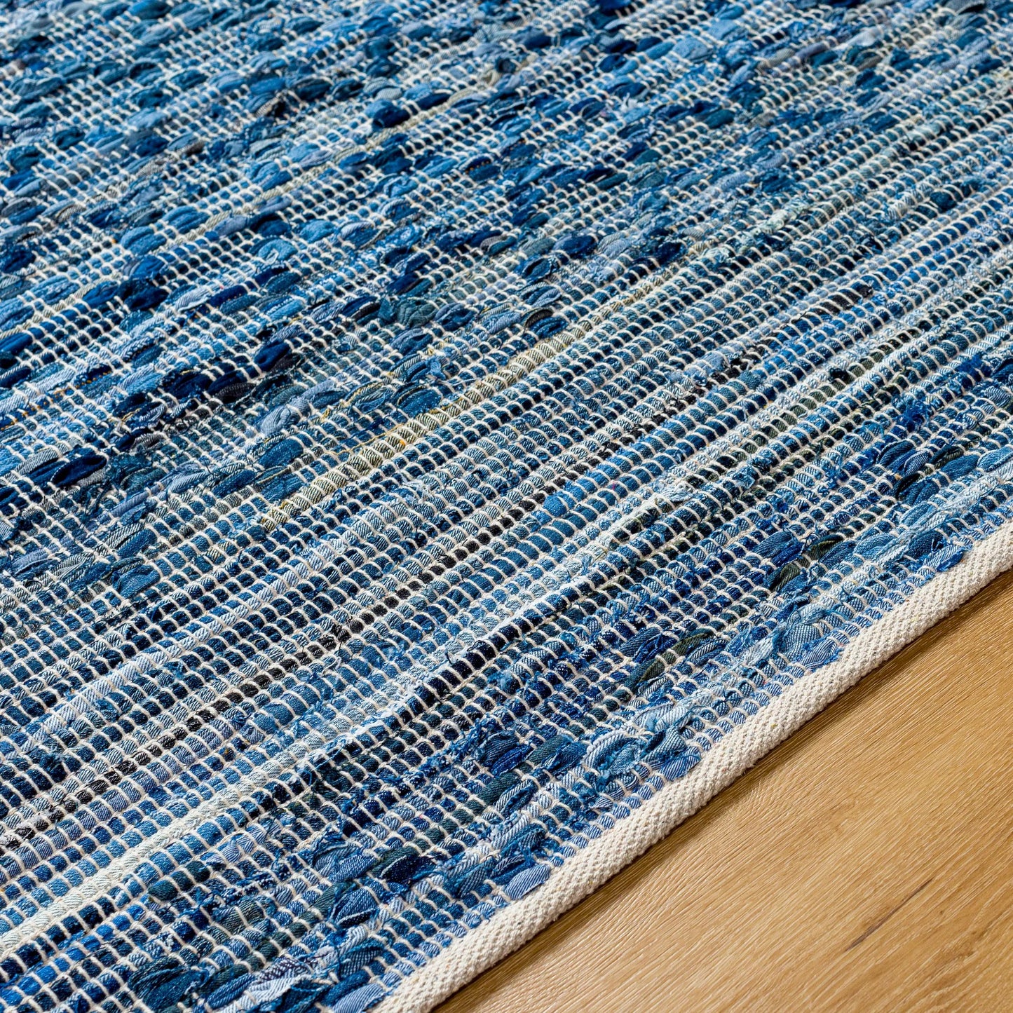 005 SI-1922029,SI-1922030,SI-1922031,SI-1922032,SI-1922033,SI-1922034 | Closeup | Jean Rug - 32476 by Livabliss in denim blue, slate gray, charcoal, sky blue, steel blue. Made from main: 100% recycled fabric in a unique style.
