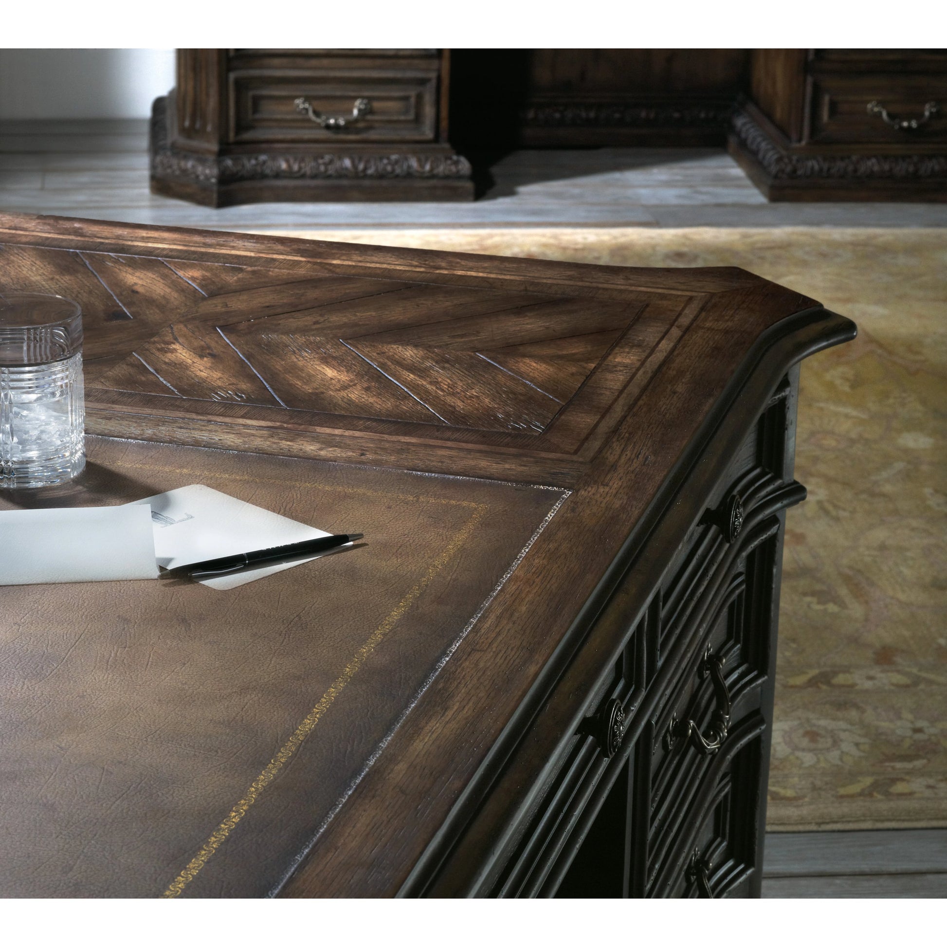Rhapsody Executive Desk by Hooker Furniture in rustic walnut. Made from pecan, hickory, ash, black walnut, maple veneers with resin, high quality bonded leather in a traditional style.