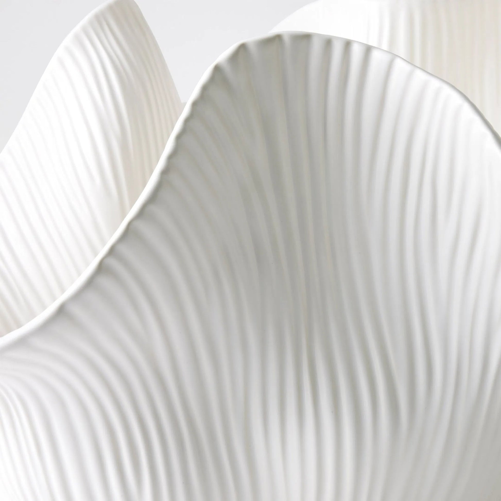 Scallop Bowl by Global Views. Made from ceramic in a modern style.
