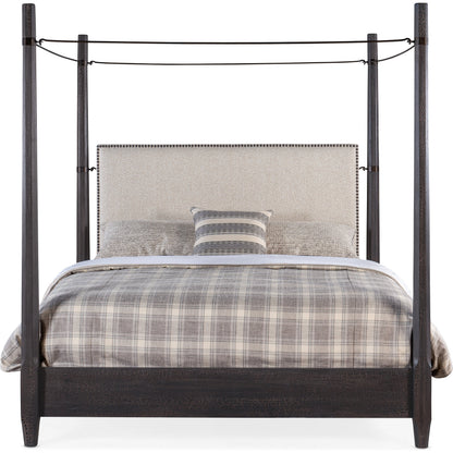 Big Sky Poster Bed by Hooker Furniture in beige and charred timber. Made from pecky hickory veneers, fabric, metal, nailheads in a modern style.