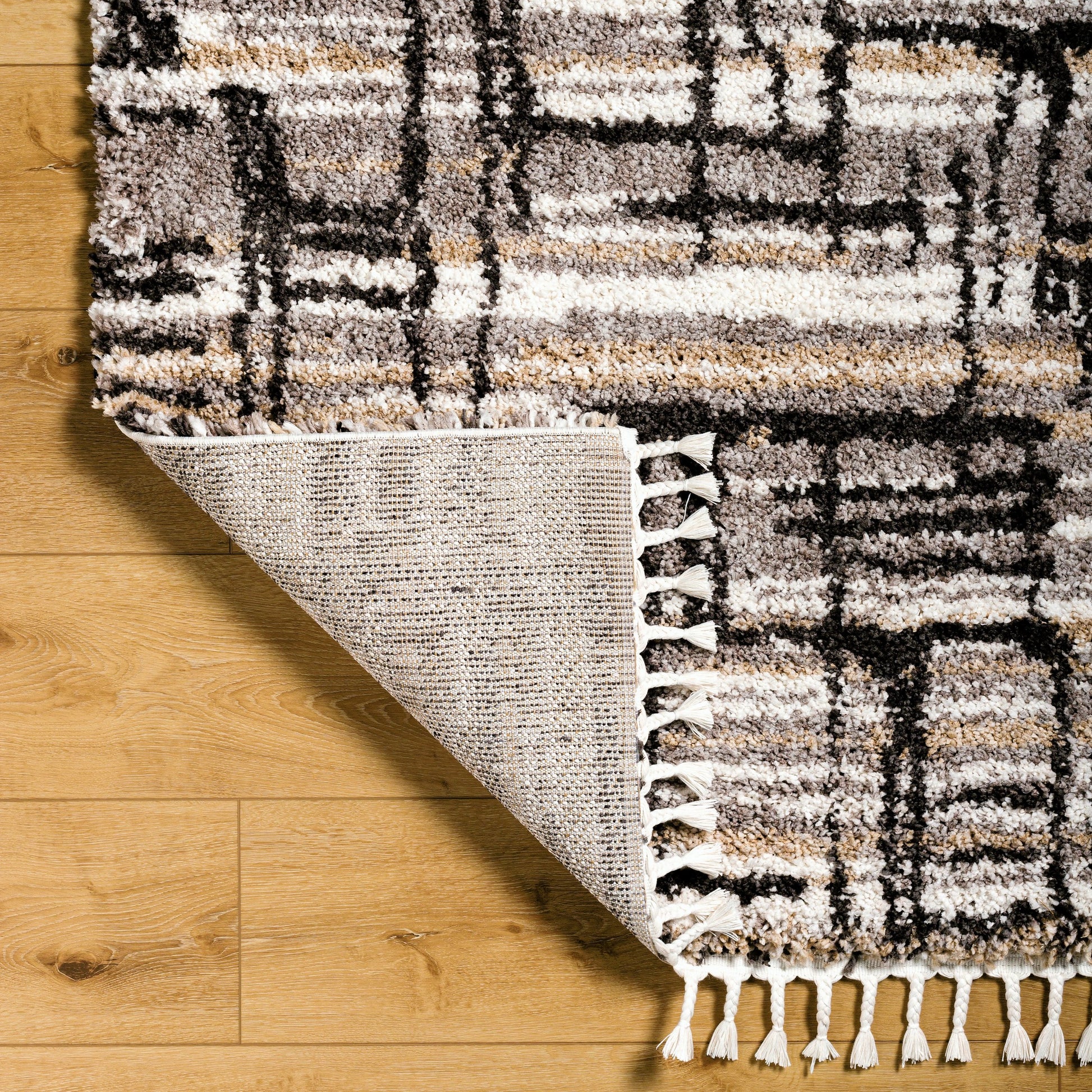 Jakarta Rug by Livabliss in gray, black. Made from main: 100% polyester in a modern style.