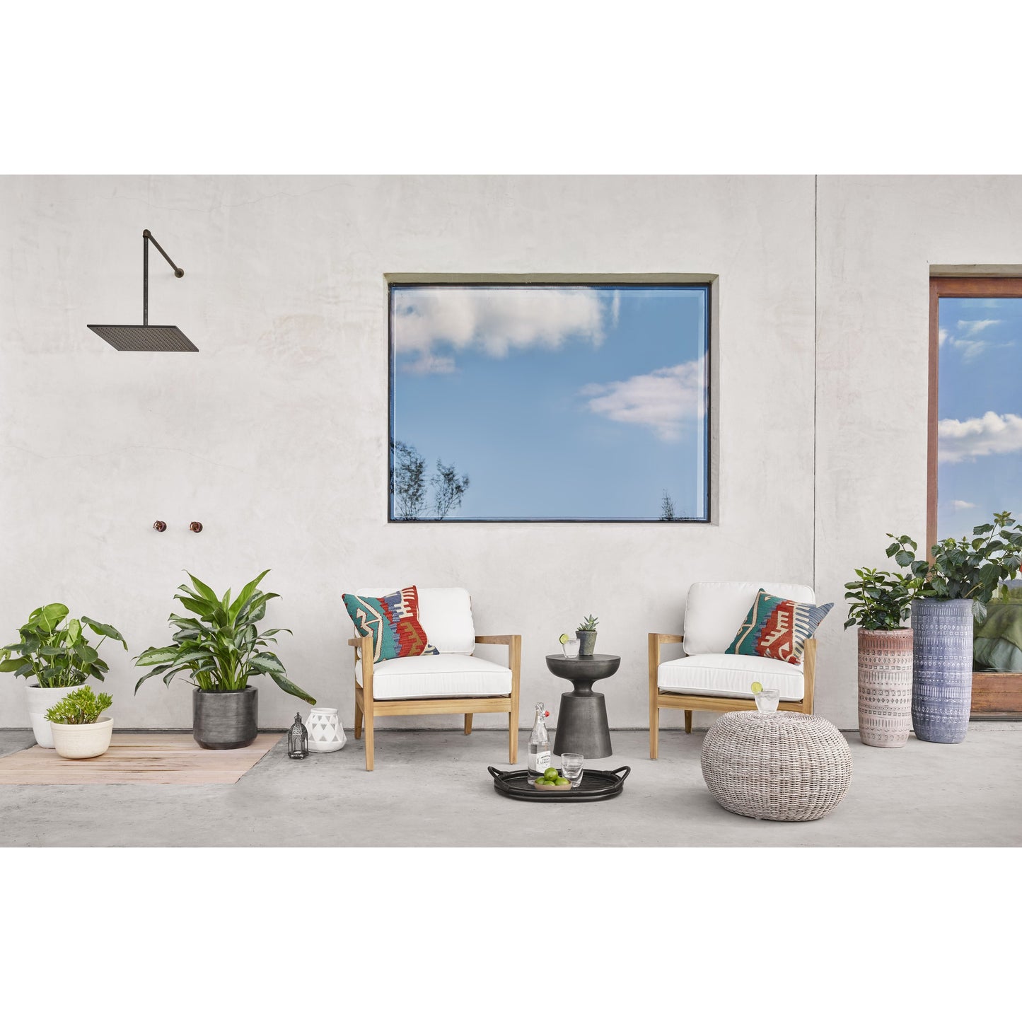 005 SR-369173 | Lifestyle | Phoenix Outdoor Accent Stool by Four Hands in vintage white. Made from 100% polyethylene, aluminum in a coastal style.