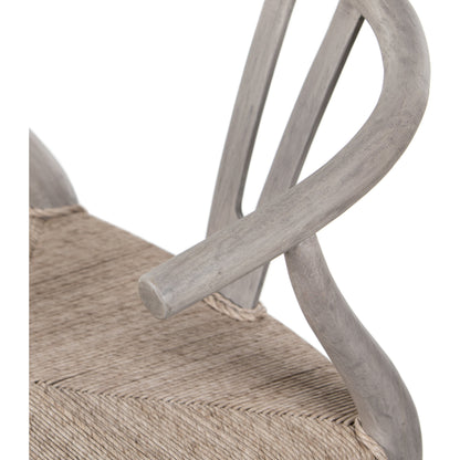 Muestra Dining Chair by Four Hands. Made from solid teak, 100% polyethylene in a coastal style.