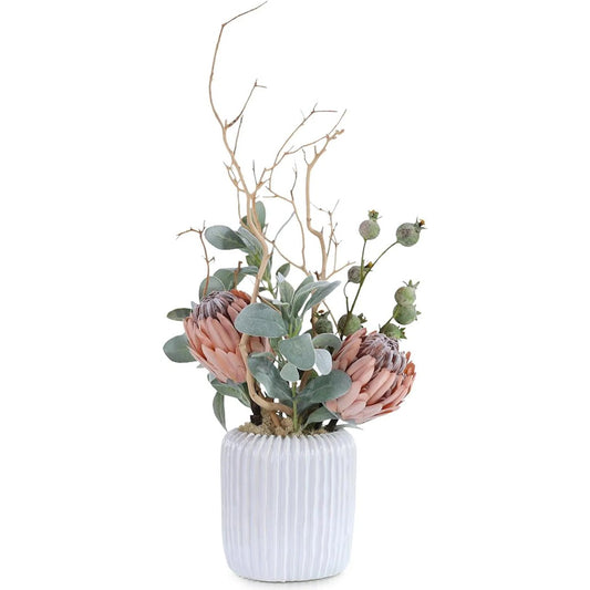 Desert Blooms by John-Richard in green, pink, brown, white. Made from ceramic, flocked protea, pomegranate pods, lamb’s ear, manzanita branches, reindeer moss in a unique style.
