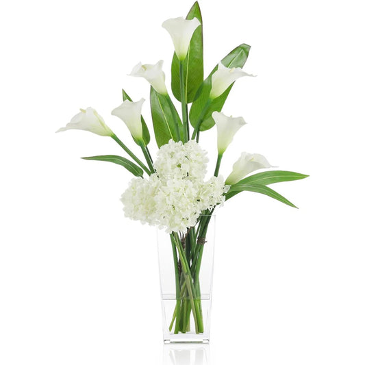 Callas and Pickerel by John-Richard in white, green, clear. Made from calla lilies, pickerel glass, faux water in a unique style.