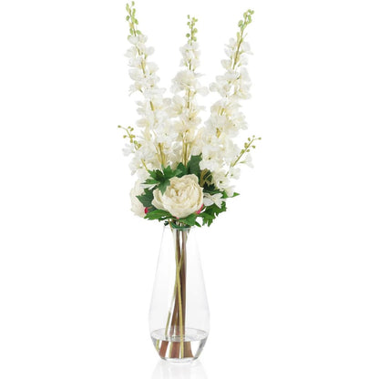 Delphinium Dreams by John-Richard in white, green, clear. Made from garden delphiniums, peonies, glass, faux water in a transitional style.