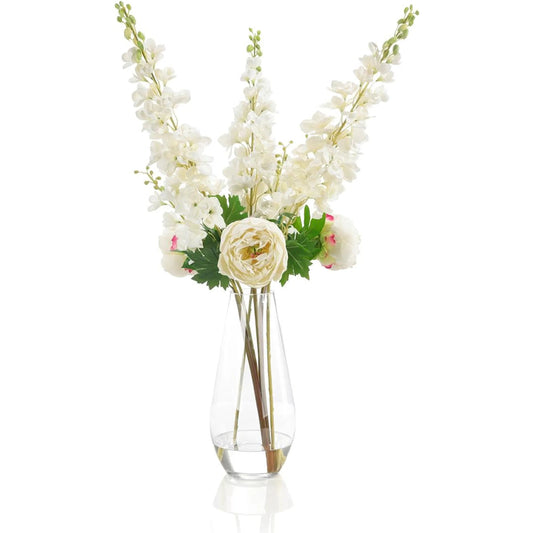 Delphinium Dreams by John-Richard in white, green, clear. Made from garden delphiniums, peonies, glass, faux water in a unique style.